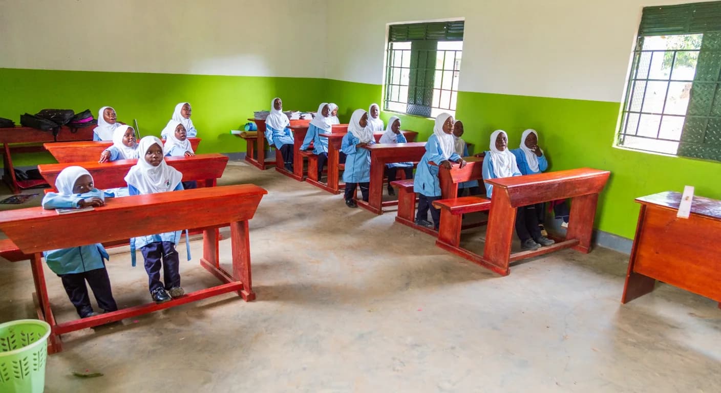 A bright classroom with green walls